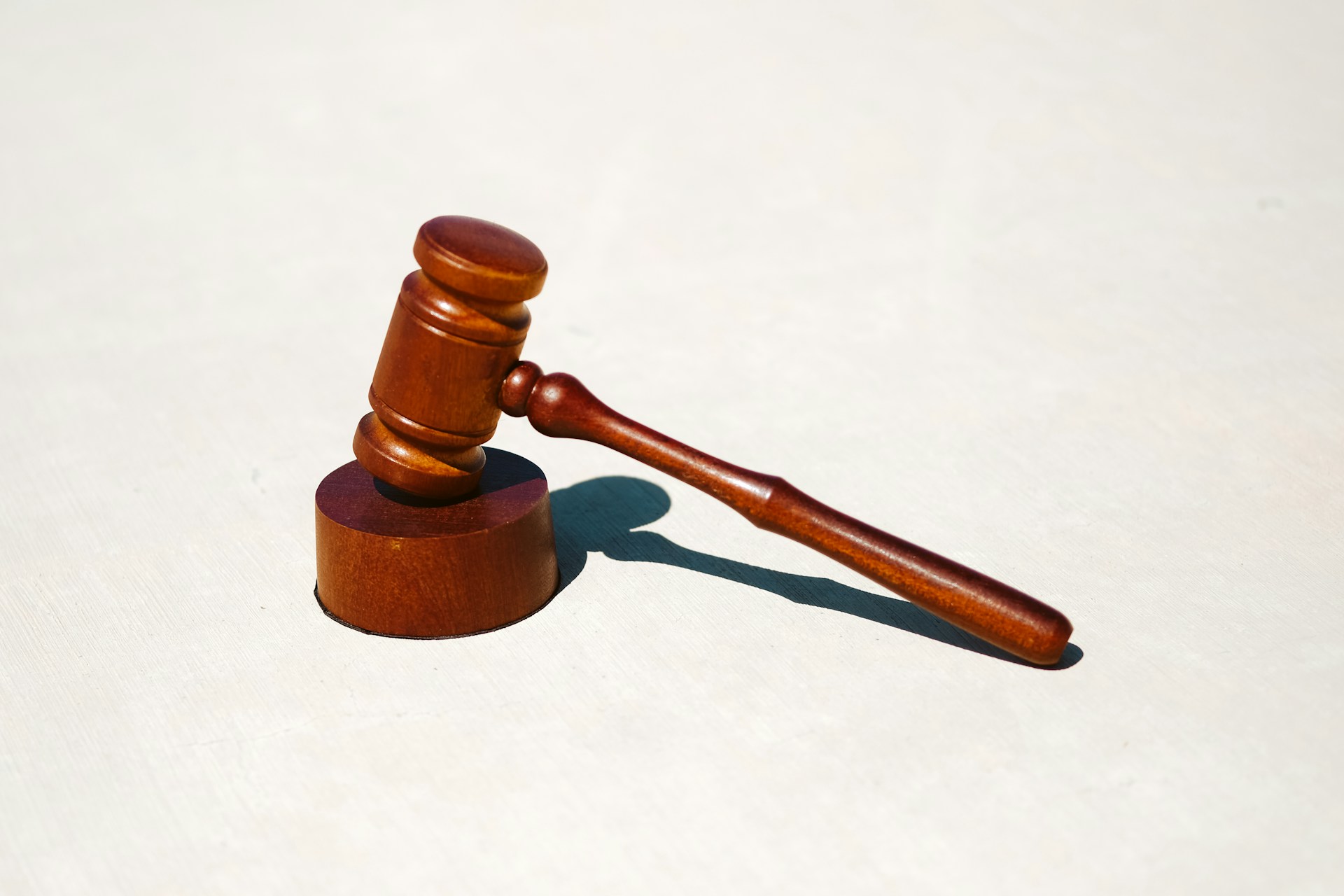 How to Choose a Criminal Defense Attorney, picture of a gavel on a white background